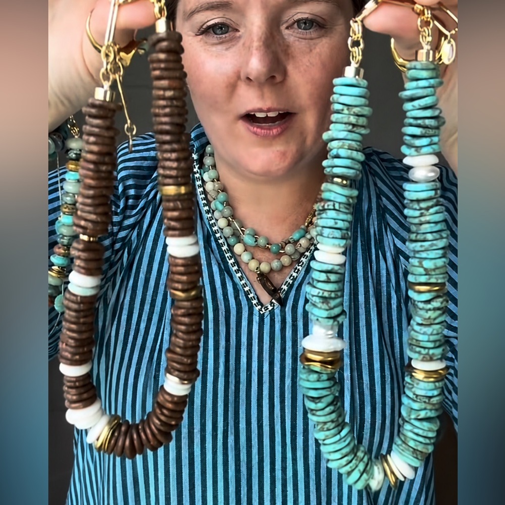 Dorsea. Handcrafted Turquoise Disk Bead Necklace Gold Accents. Shapes the neck.